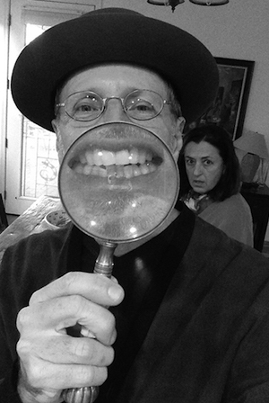 Photo of author David Gilmore holding up a magnifying glass to enlarge his smileBook cover of 